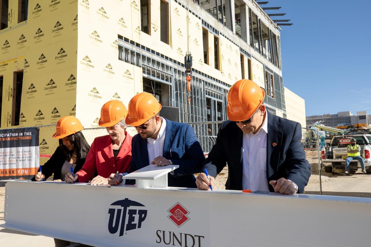 Today, officials from The Ƶ of Texas at El Paso and Sundt Construction celebrated a major milestone in the dvanced Manufacturing and Aerospace Center building’s progress — the Topping Out Ceremony.  Officials including, (from left) UTEP Student Government Association President Andrea Nunez, President Heather Wilson, Sundt Project Manager Daren Mieles and Sundt Vice President Joseph Riccillo, signed a construction beam at today's ceremony. 